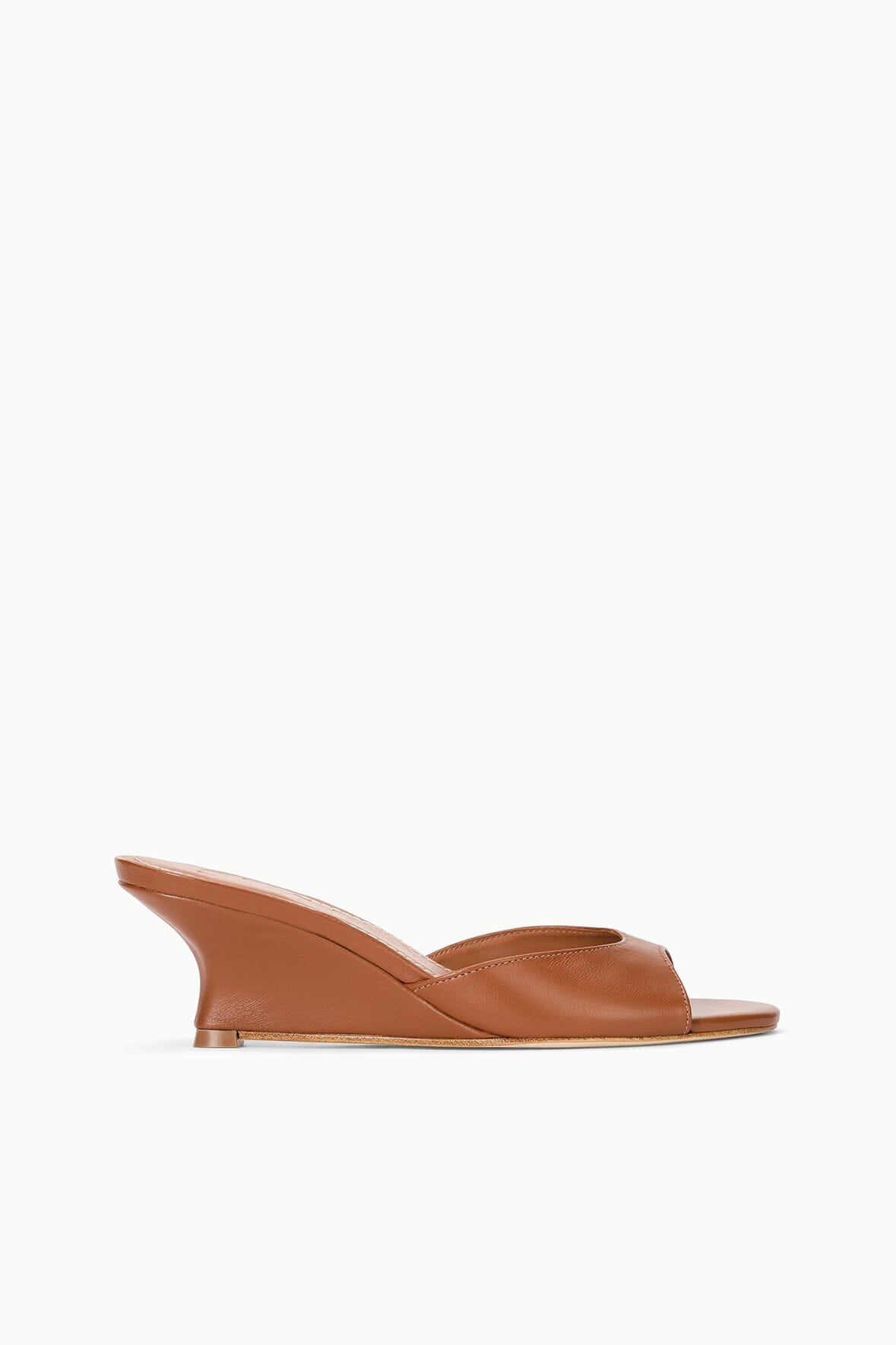 Tan leather wedge mule sandal with open toe and side cutout