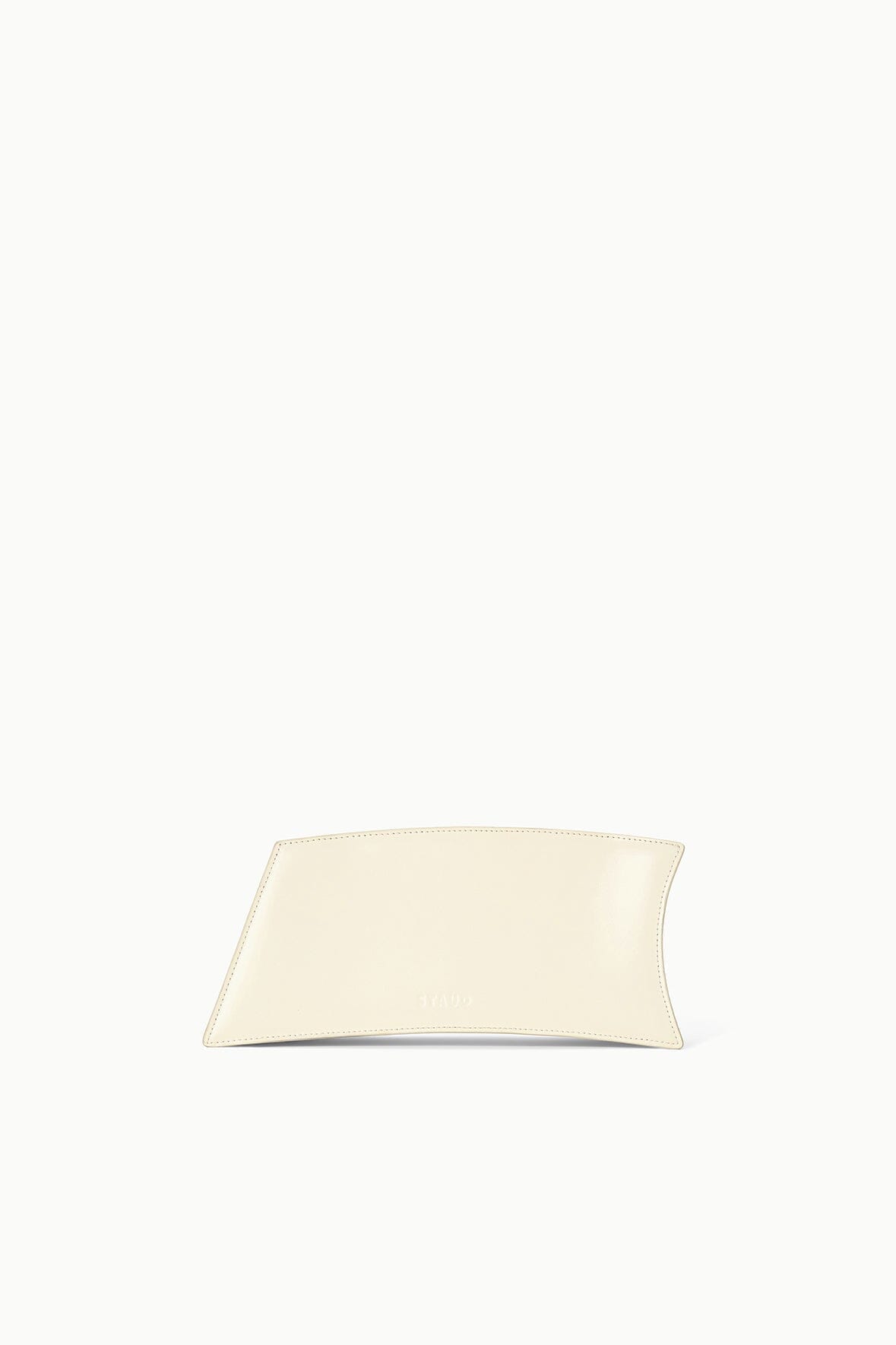Cream shoulder bag with front black dog portrait, structured shape