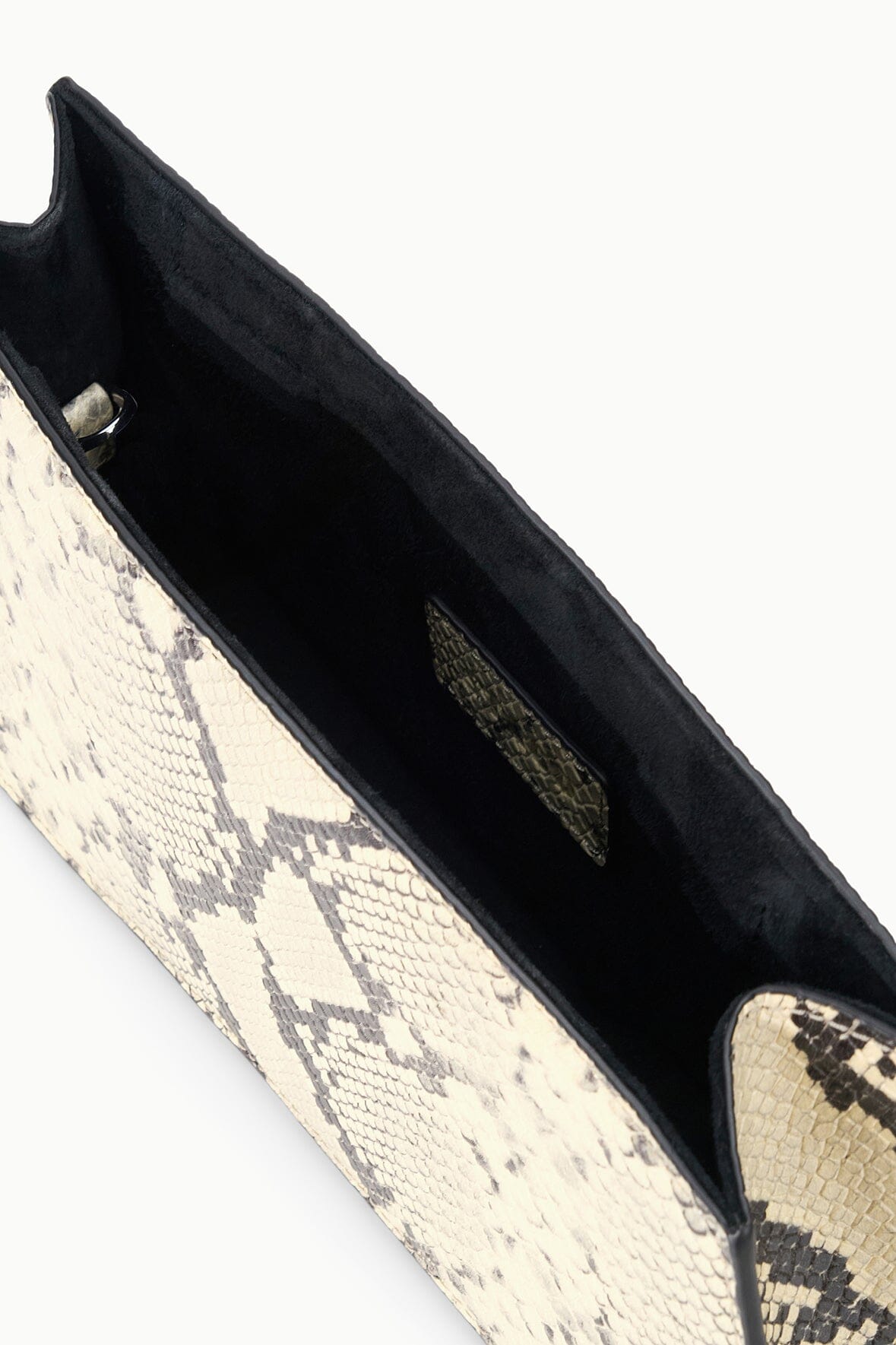 White snake-pattern shoulder bag interior view with dark lining