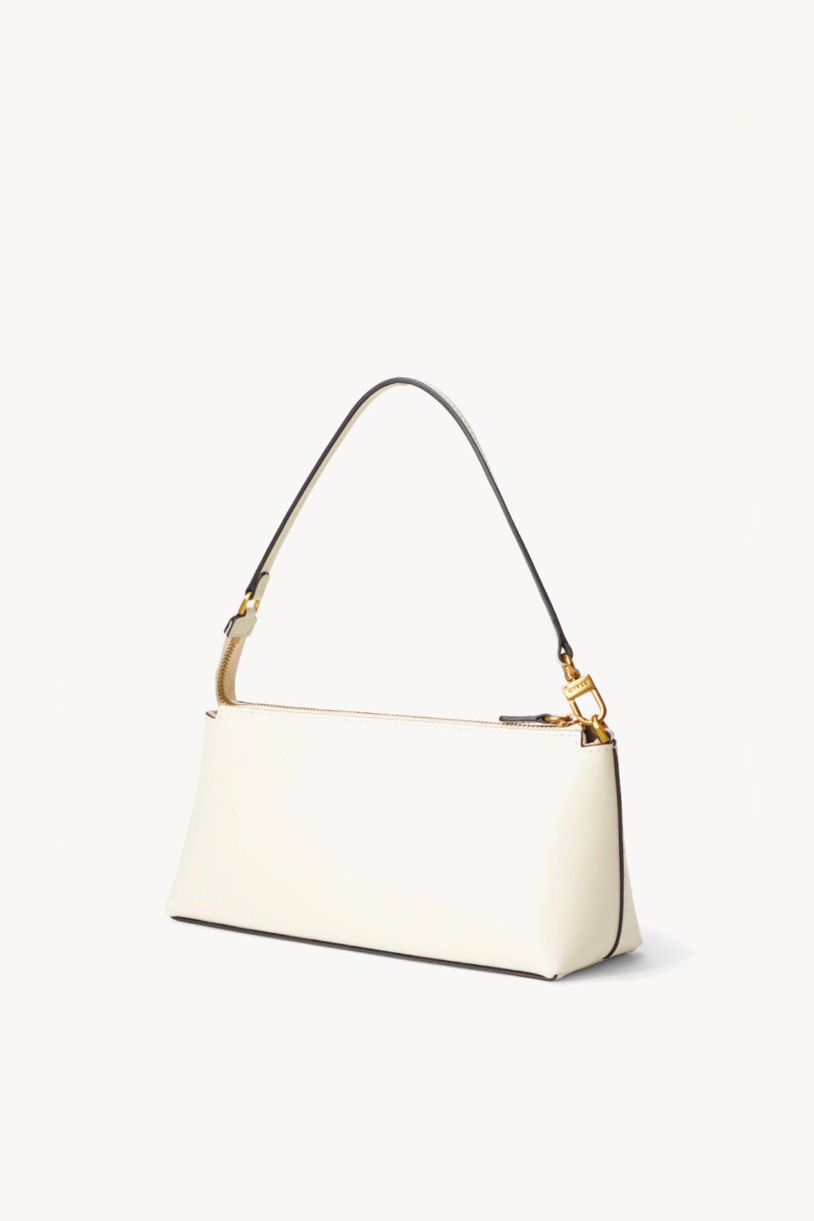 Cream shoulder bag with short top handle and long adjustable strap