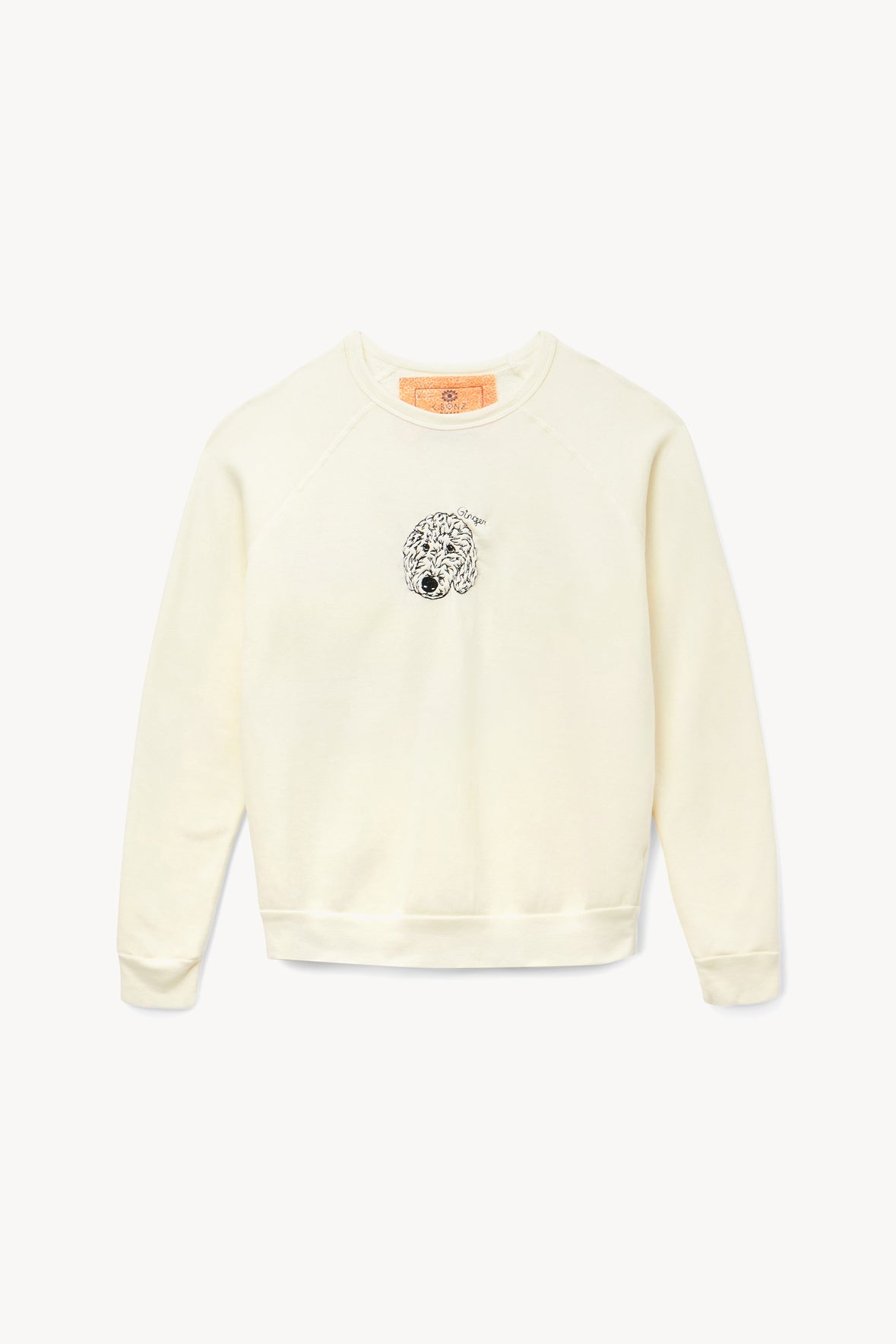 Cream sweatshirt with embroidered dog face graphic at center chest