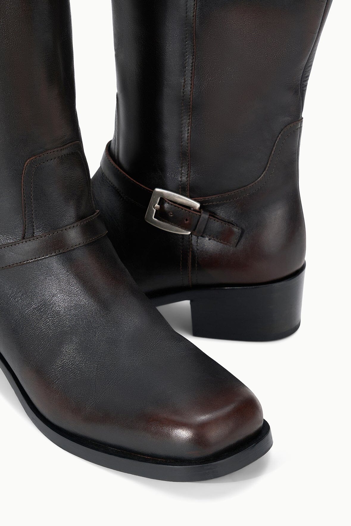 Espresso distressed leather-look boot with side buckle strap and seam lines
