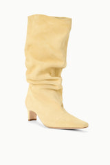 Butter slouch boot with ruched mid-calf shaft and side profile