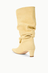 Butter slouch boot with almond toe and folded ruched shaft