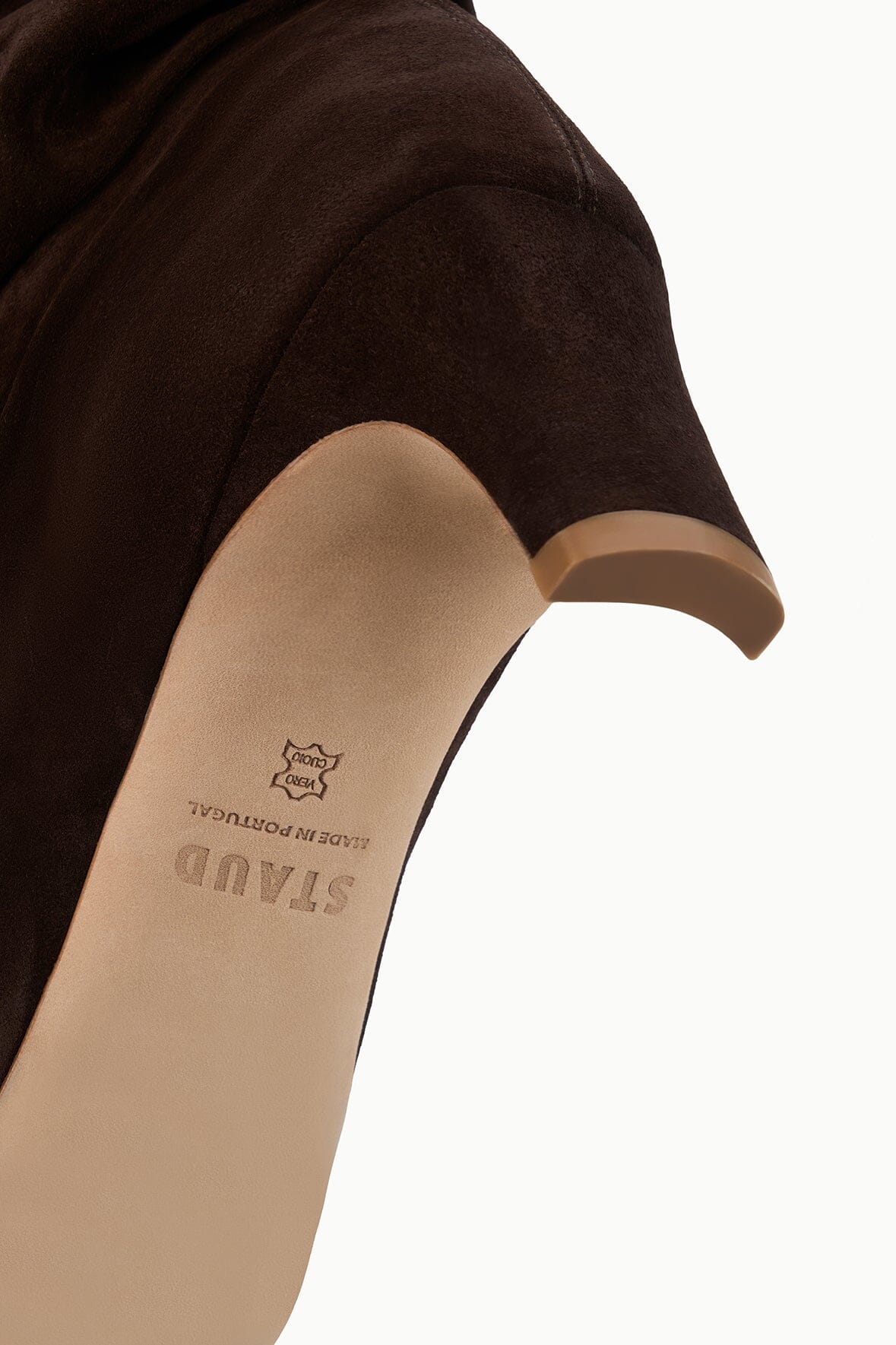 Brown suede slouch boot interior view with logo on insole and low heel