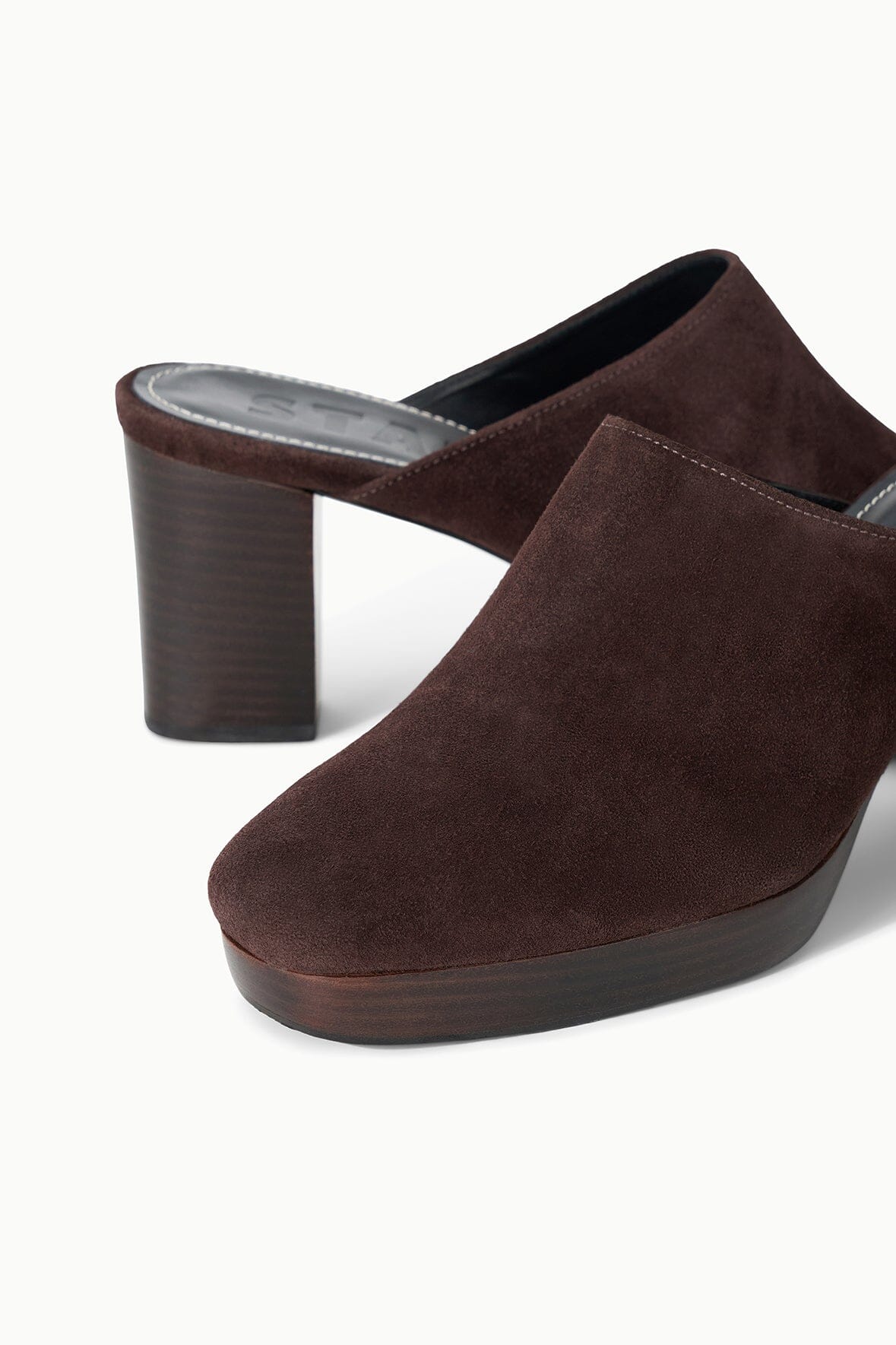 Brown suede mule with open back, cushioned footbed, and block heel