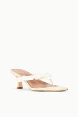 Cream slide sandal with white petal-style strap detail and slim kitten heel
