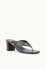 Dark brown studded thong heel mule, side view with black footbed