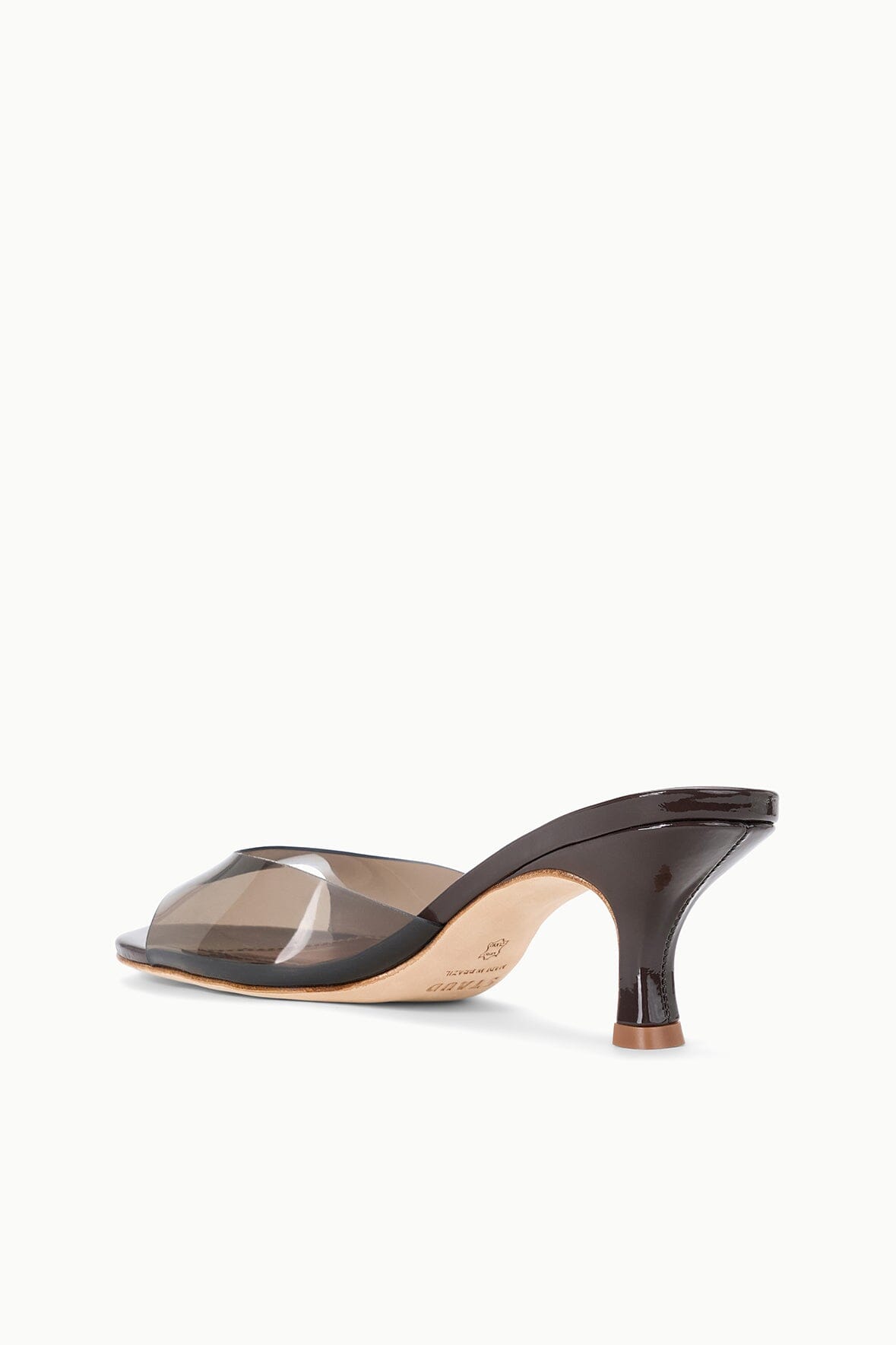 Espresso PVC mule with clear cross-strap opening and mid heel, front angle
