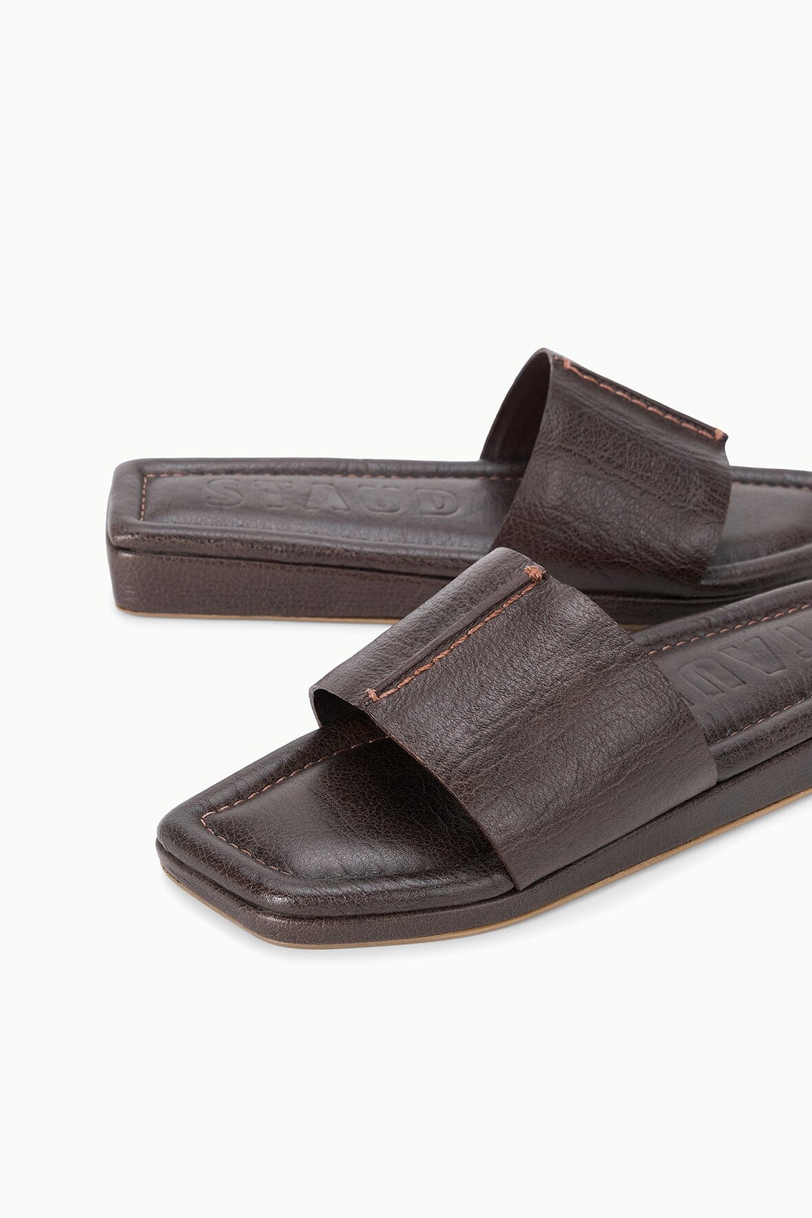 Espresso brown leather slide sandal with stitched wide strap and platform base