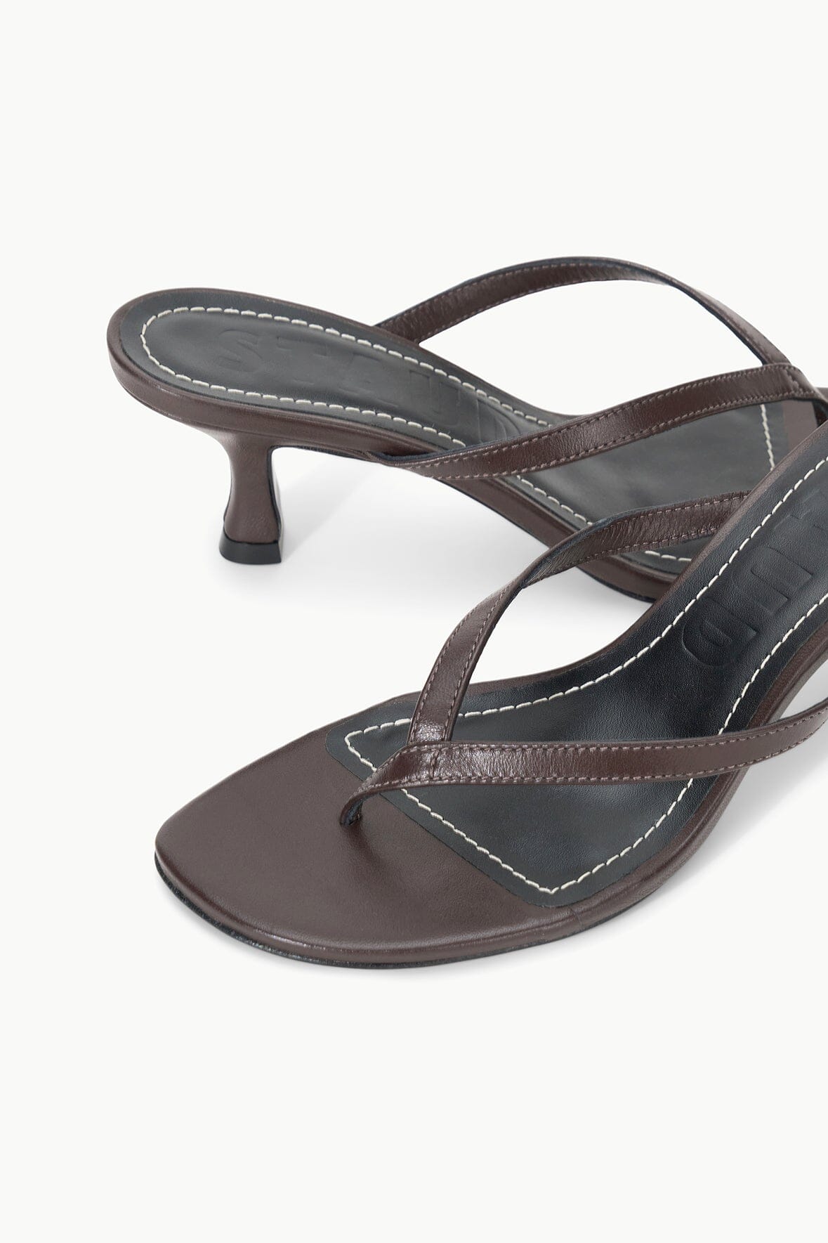 Espresso leather thong sandals with stitched cross-strap and kitten heel