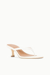 White open-toe kitten-heel slide sandal with crisscross straps and small heel