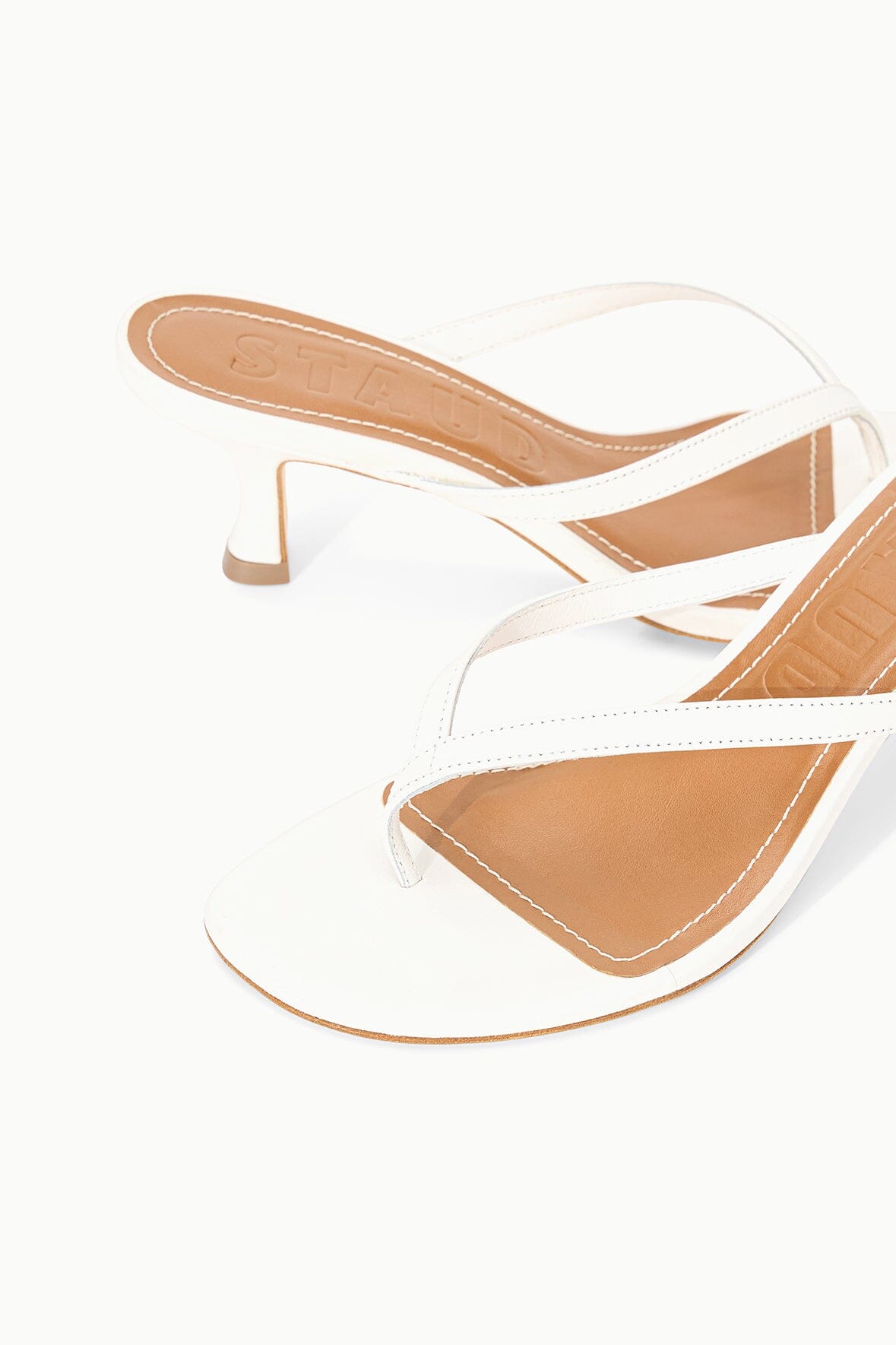 Side view white strappy kitten-heel sandals with open toe and slim mid-height heel