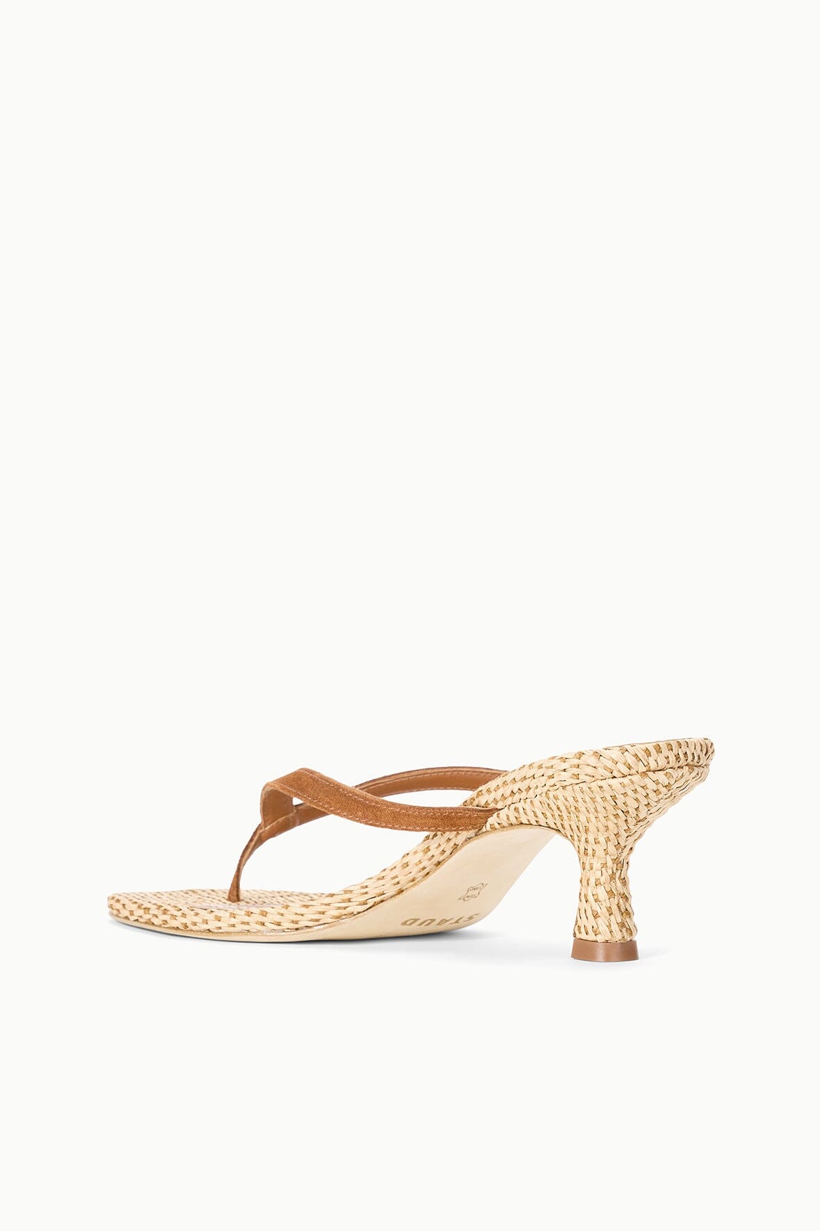 Natural woven kitten-heel thong sandals with tan leather straps and heel.