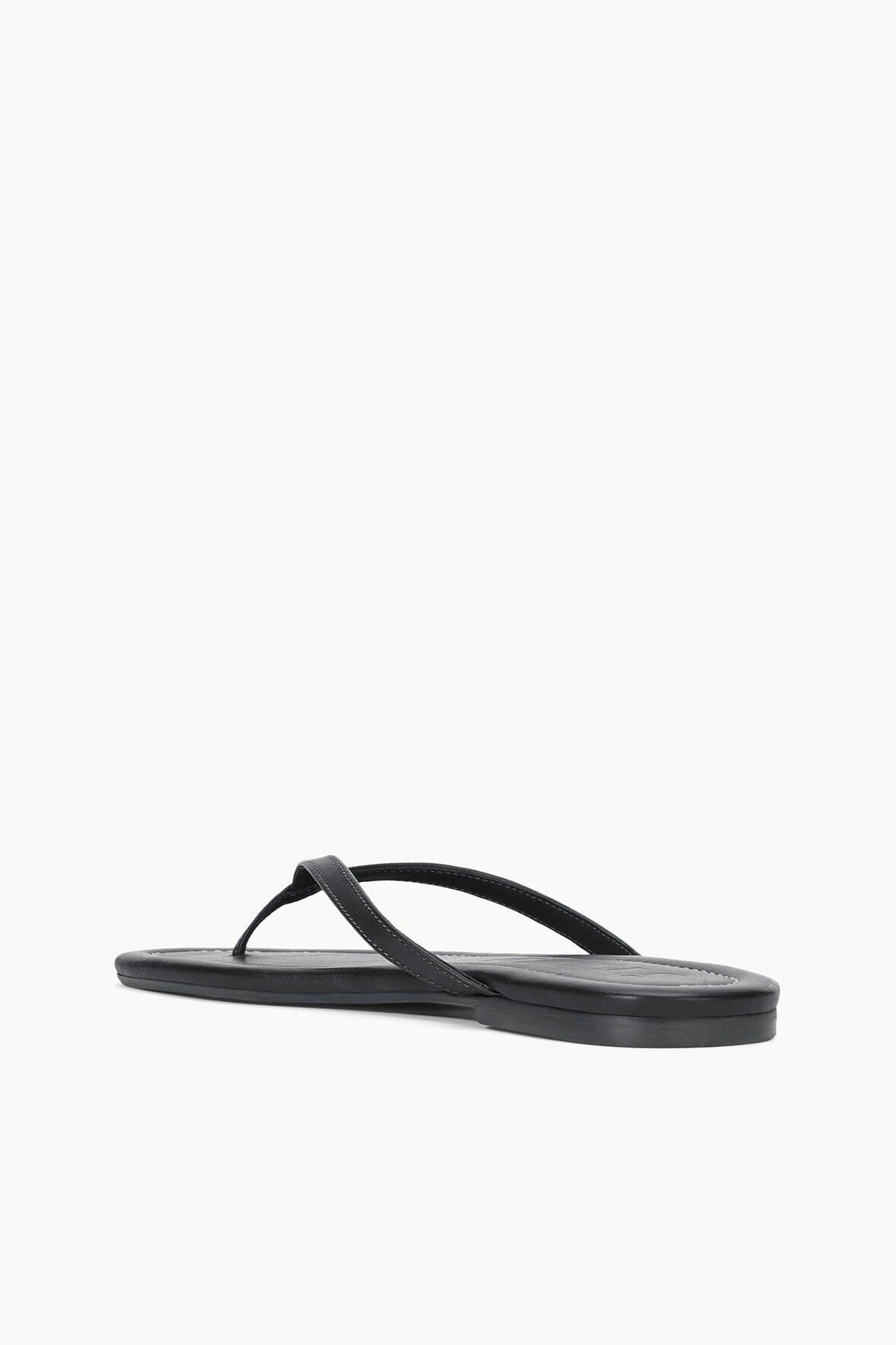 Black thong sandals in side profile with thin thong strap