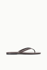 Espresso brown thong sandal in profile with narrow strap and flat outsole
