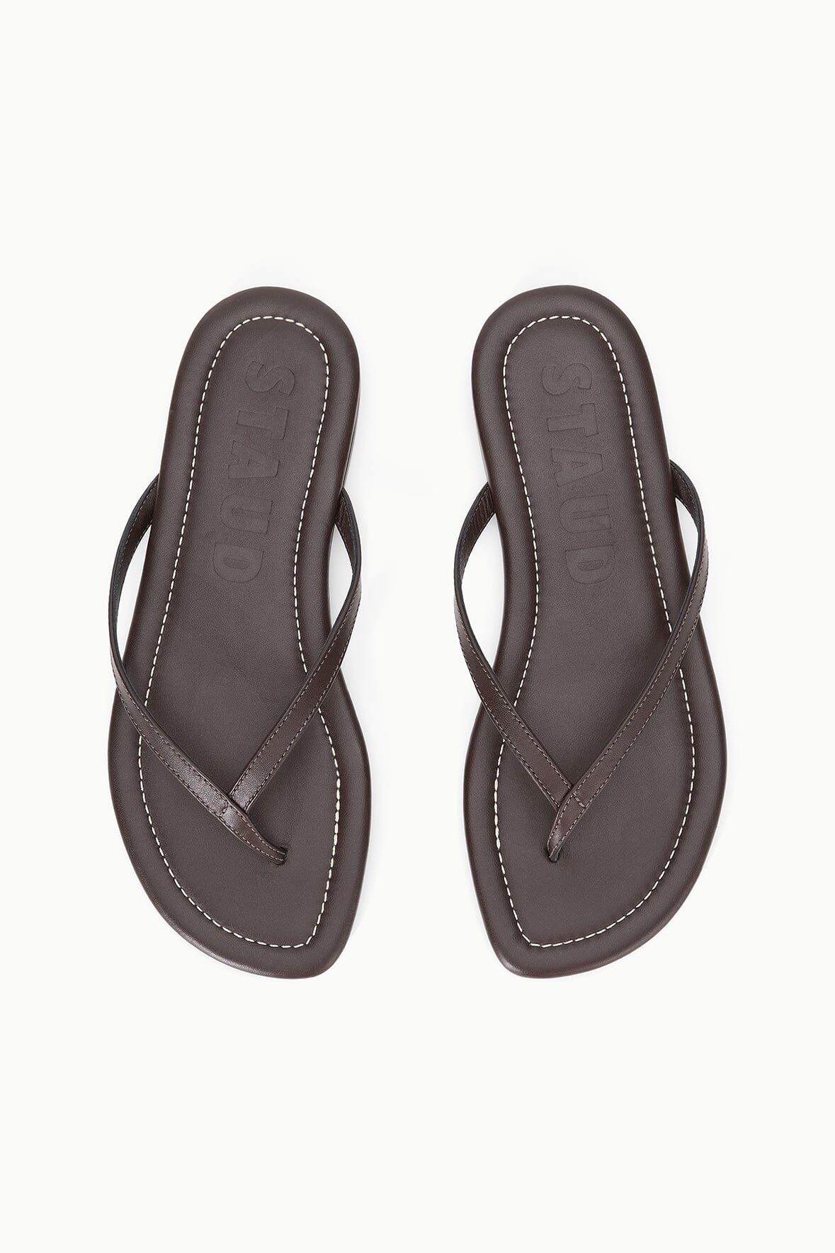 Espresso brown thong sandals with stitched straps and textured footbed