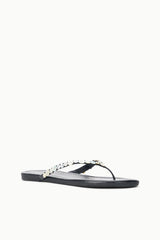 Black flip-flop sandals with pearl bead cross strap, flat sole.