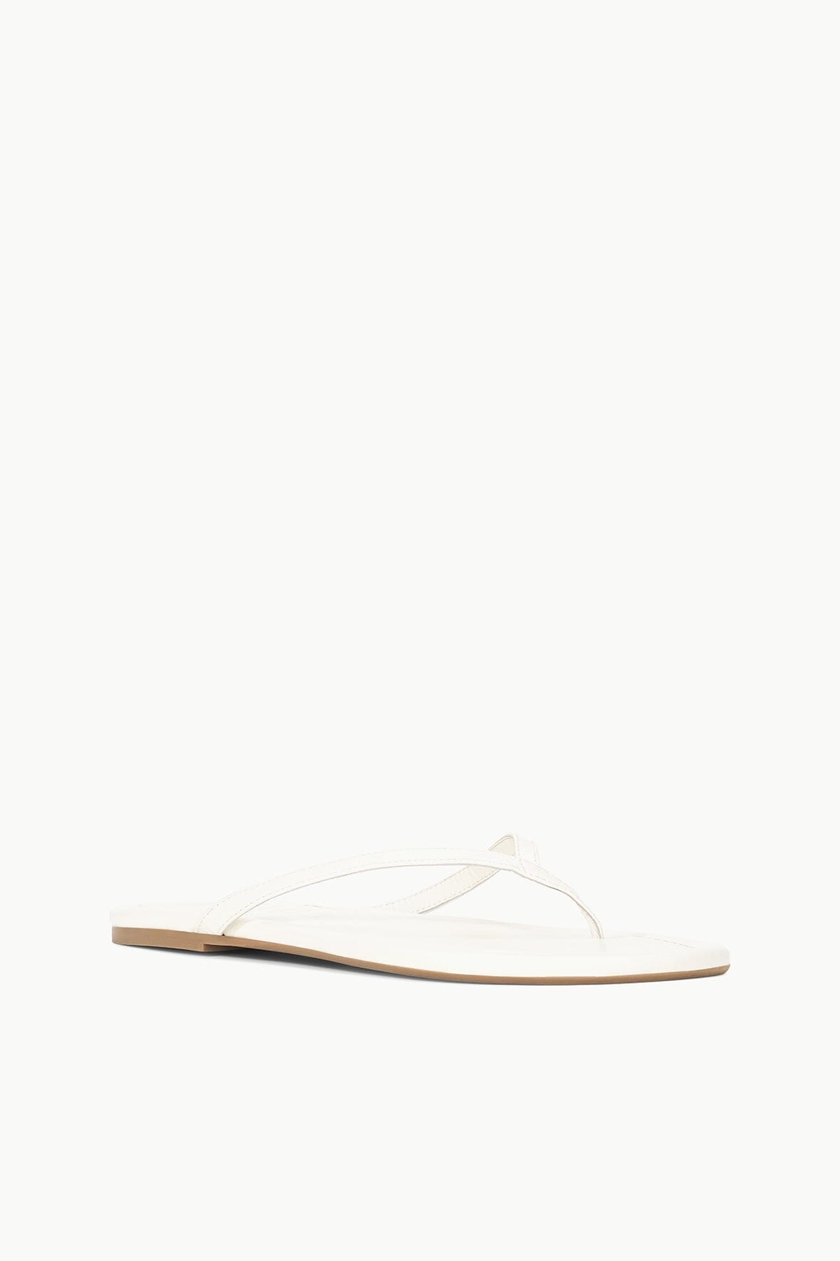 White thong sandal with crisscross straps and flat sole