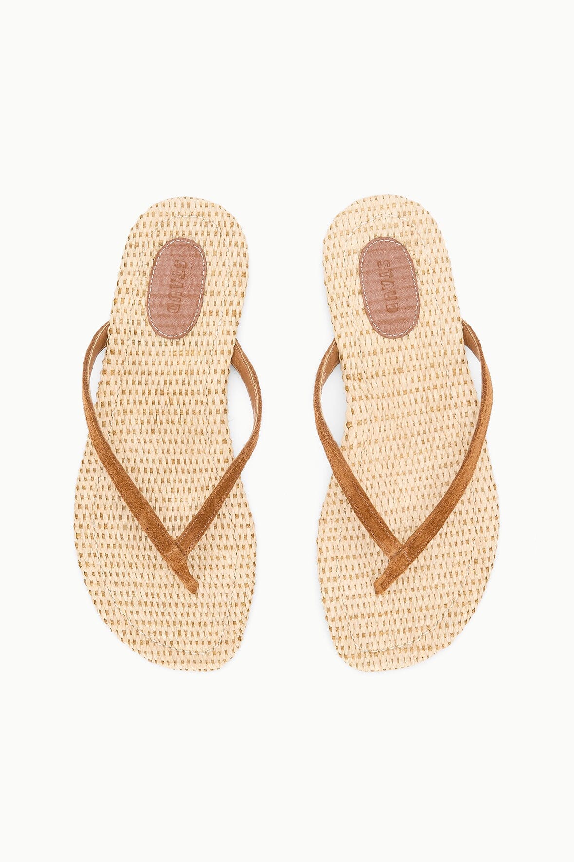 Tan woven flip-flop thongs with oval toe opening and brown cross straps