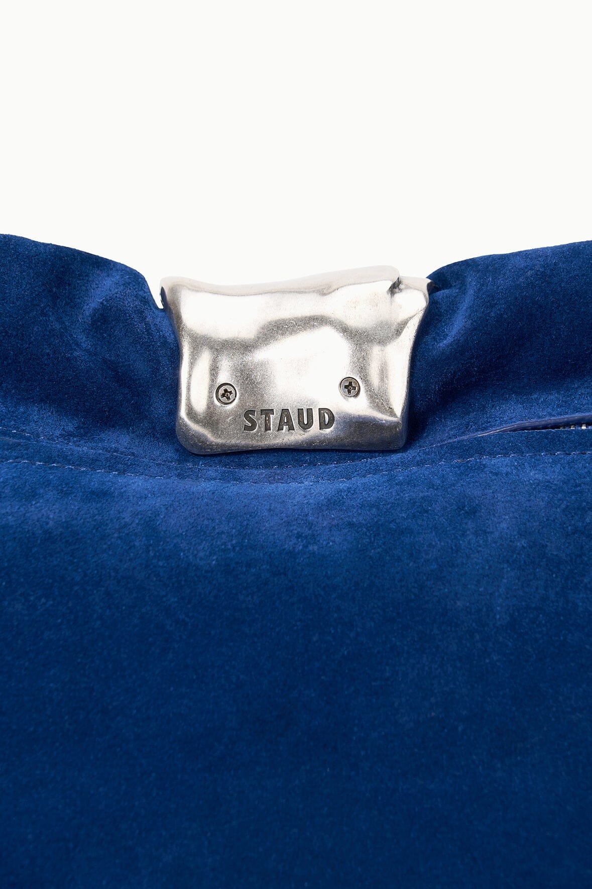 Cobalt suede clutch flap with silver-tone STAUD logo plate clasp