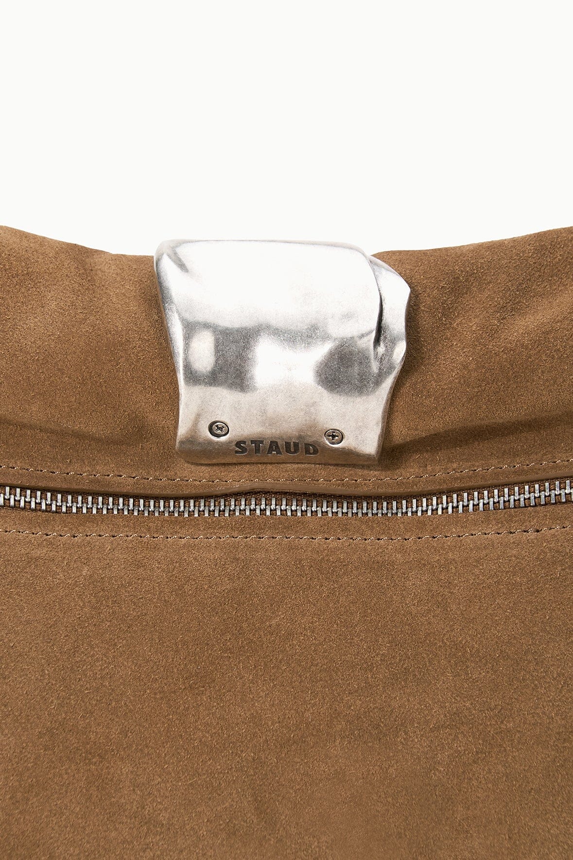 Silver cuff hardware with STAUD logo on Husk brown clutch flap