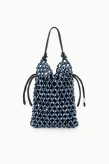 Dark blue beaded bucket bag with top drawstring cords and black handles