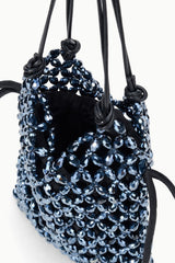 Dark blue beaded bucket bag with black interior lining and knotted drawstring cords