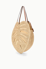 Large natural raffia palm leaf tote bag with brown leather handles and side pocket