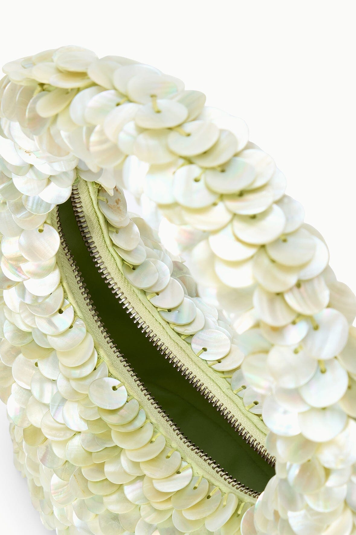Light-green sequin-shell bag with zipper track and green interior trim