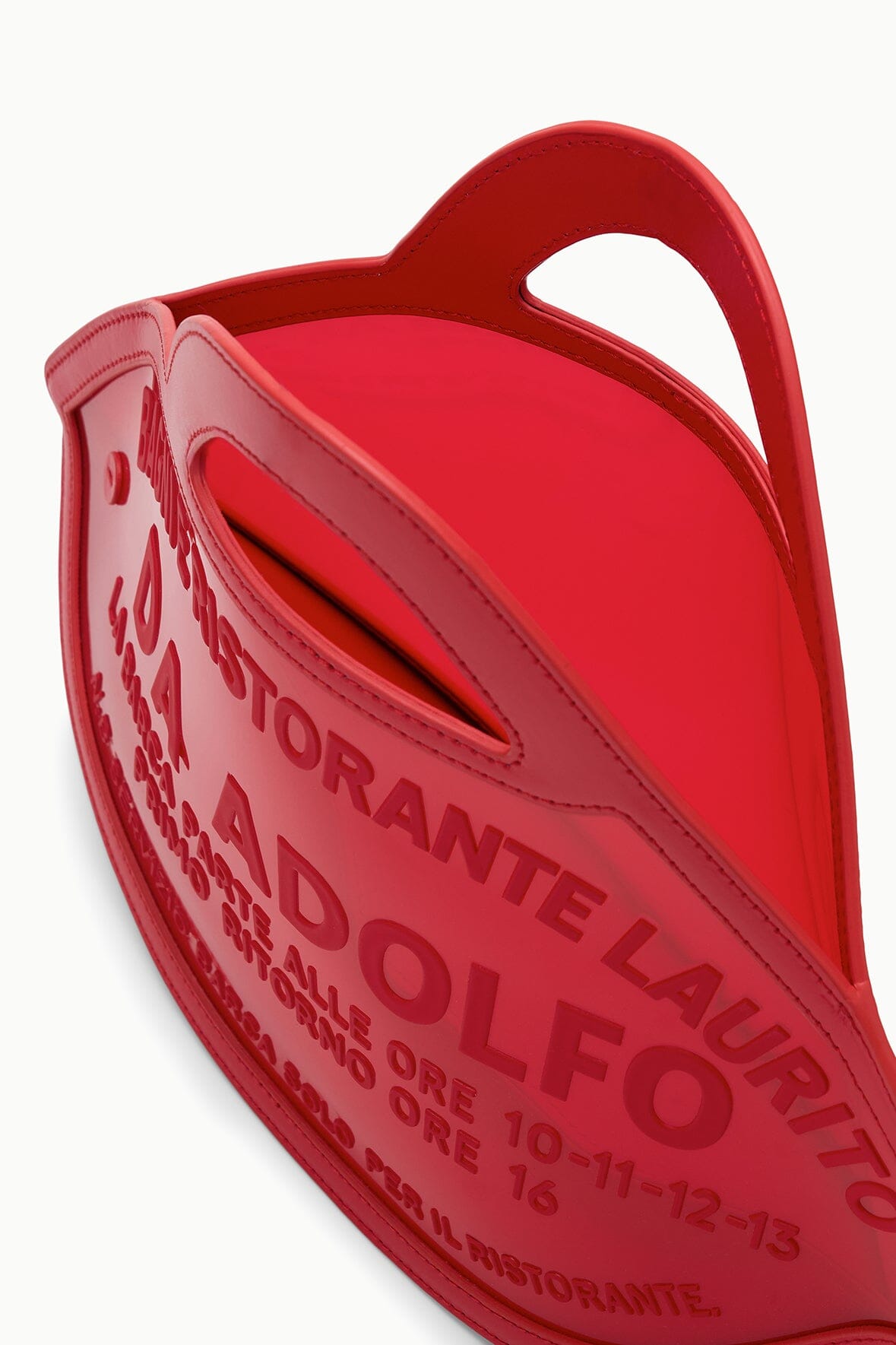 Red fish-shaped bag with top opening, stitched edges, and logo text visible