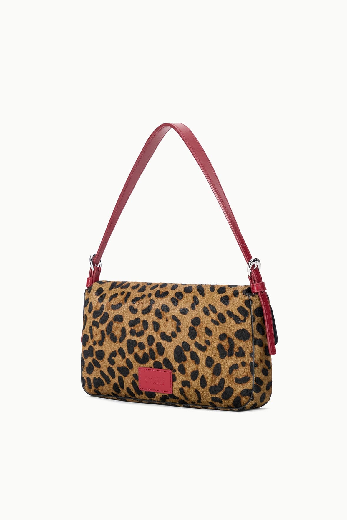 Cheetah-print shoulder bag with red handles and small logo patch, rear view