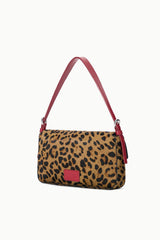Cheetah-print shoulder bag with red handles and small logo patch, rear view