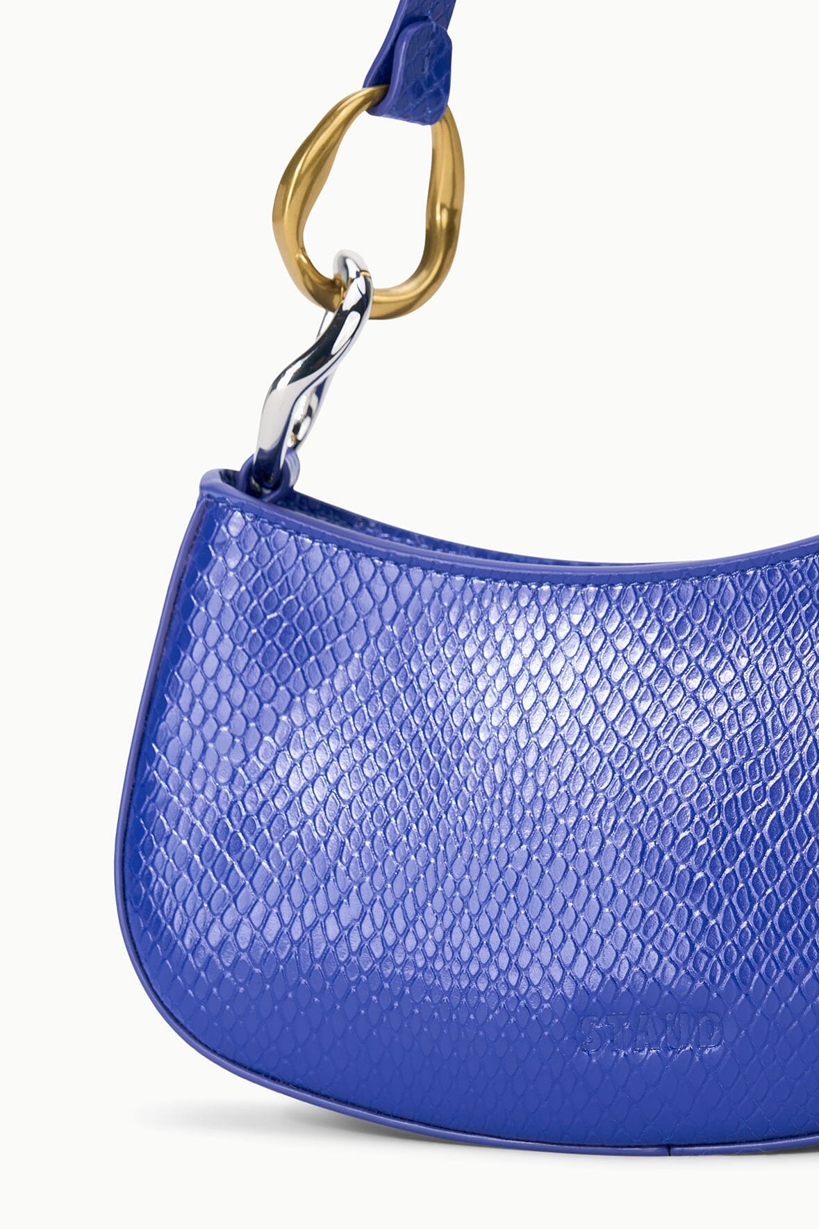 Cobalt blue textured hobo handbag with gold-and-silver keyring handle detail