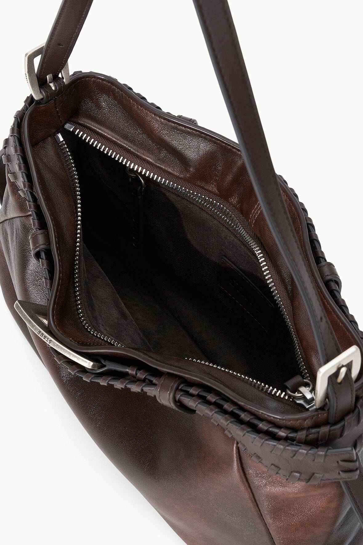 Espresso-brown shoulder bag open view with black interior and zip pocket.