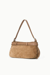 Tan suede shoulder bag with woven front trim and silver buckle, side view