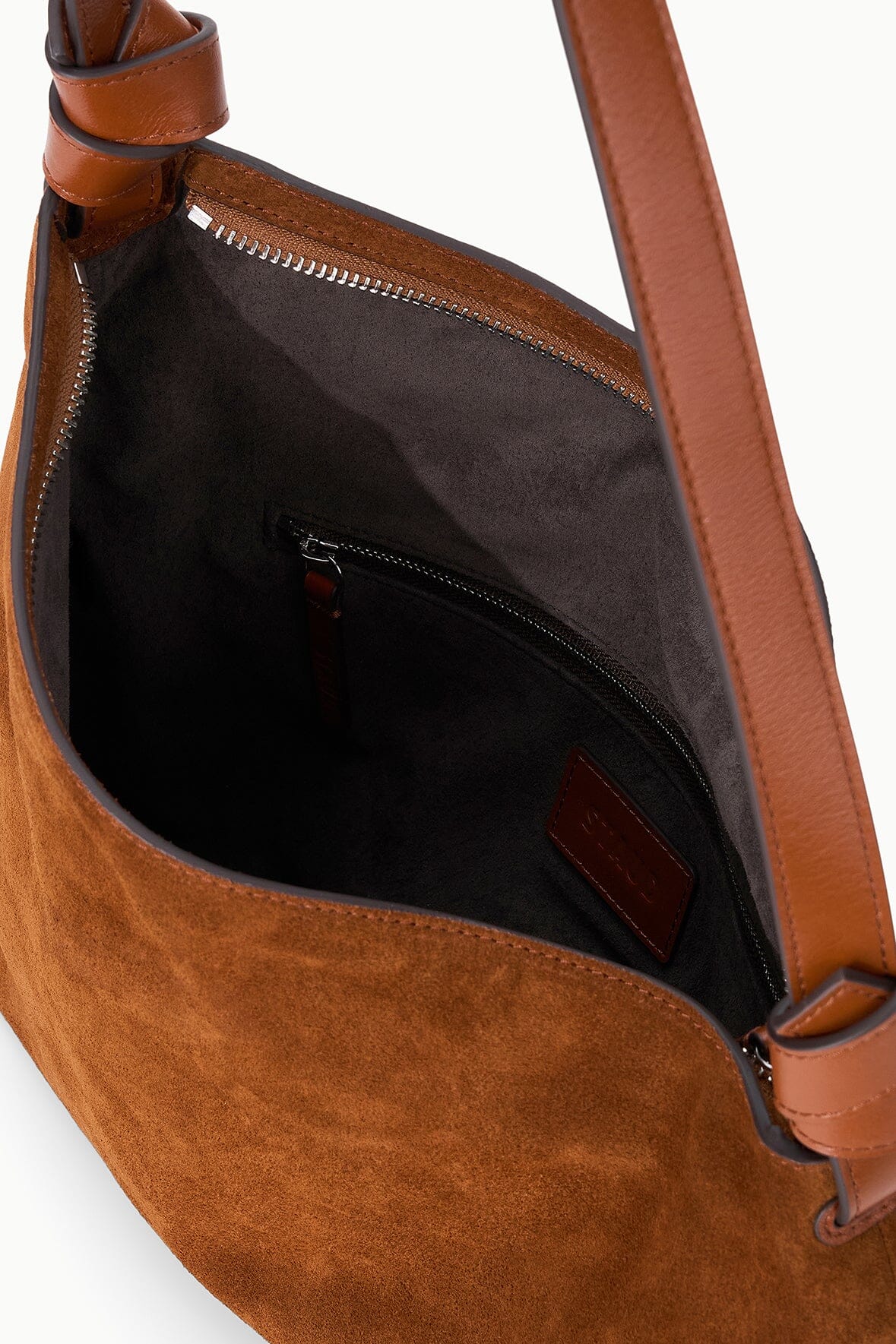 Tabac suede shoulder bag interior with zippered pocket and leather-trim lining