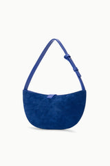 Cobalt crescent suede shoulder bag with soft rounded shape and top strap