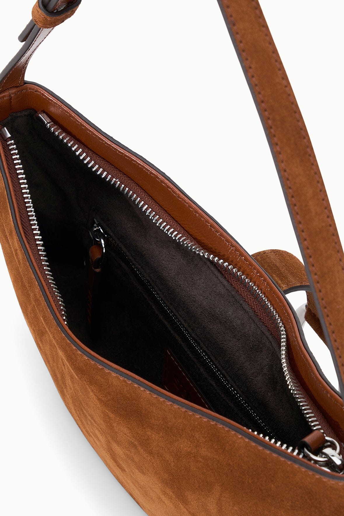 Tabac suede shoulder bag close-up of interior zipper and stitching