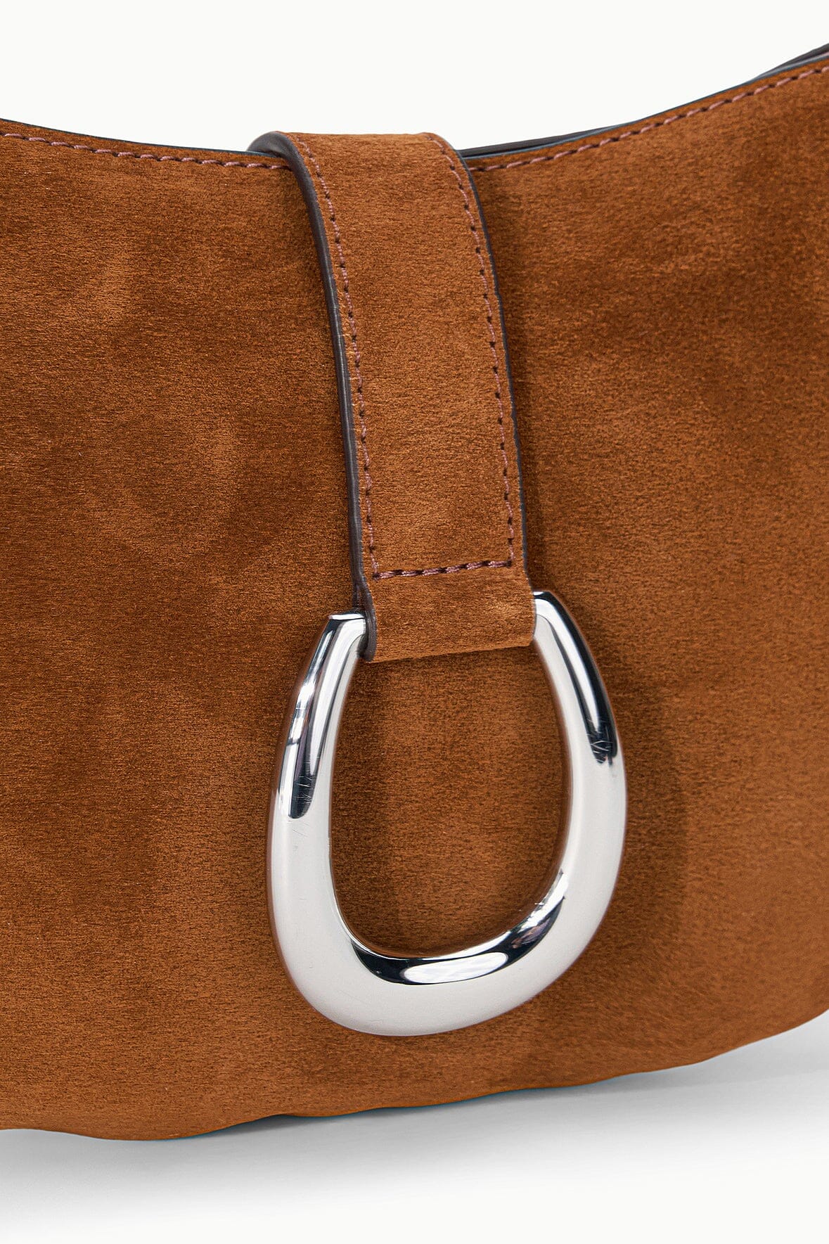 Tabac suede shoulder bag close-up of silver ring clasp on strap
