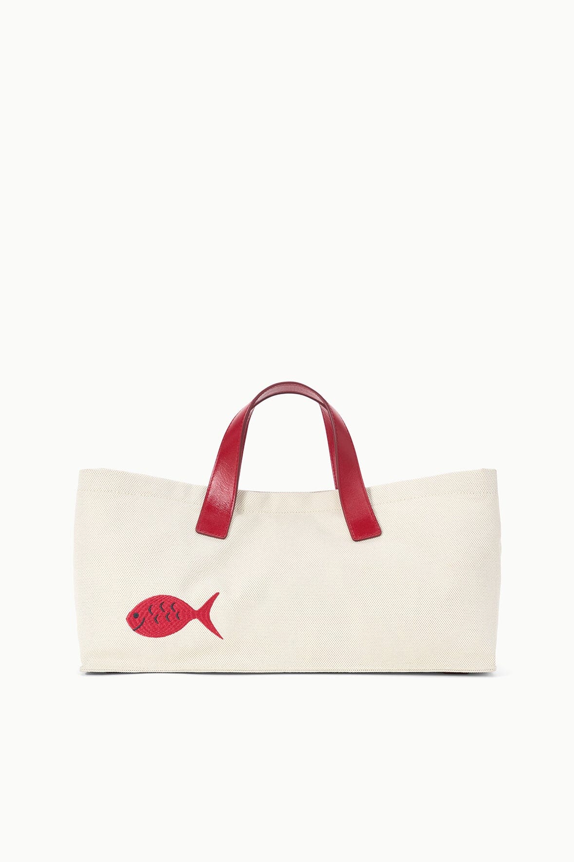 Cream tote bag with red top handles and small red fish applique on front