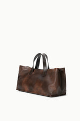 Espresso-brown distressed leather port tote with top handles, structured shape