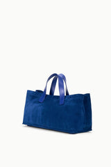 Cobalt blue port tote angled view, short handles and roomy open main compartment