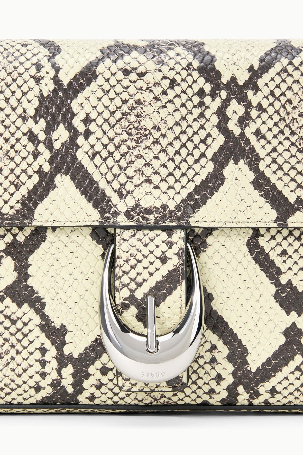 Snake-print Harlow bag flap with silver oval clasp and curved loop hardware
