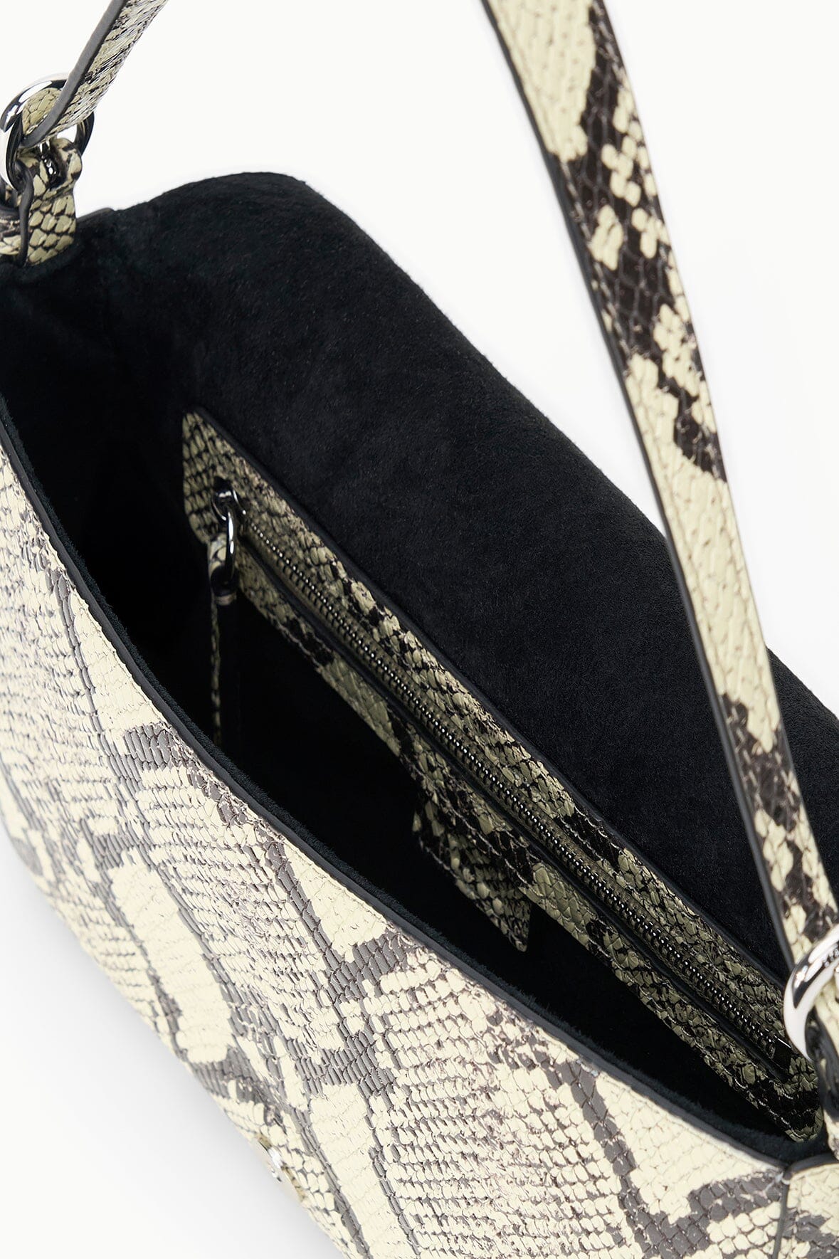 Snake-print Harlow bag interior with dark lining and zip pocket panel