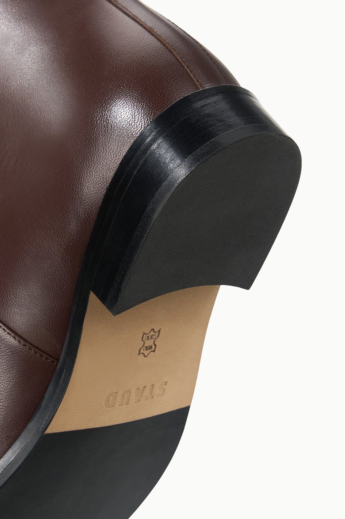 HARLOW riding boot close-up of dark heel and outsole edge