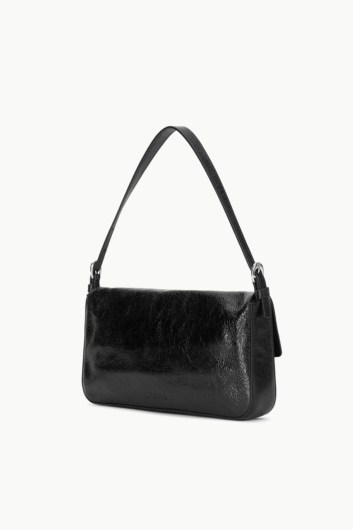 Black leather shoulder bag with adjustable strap and flap closure