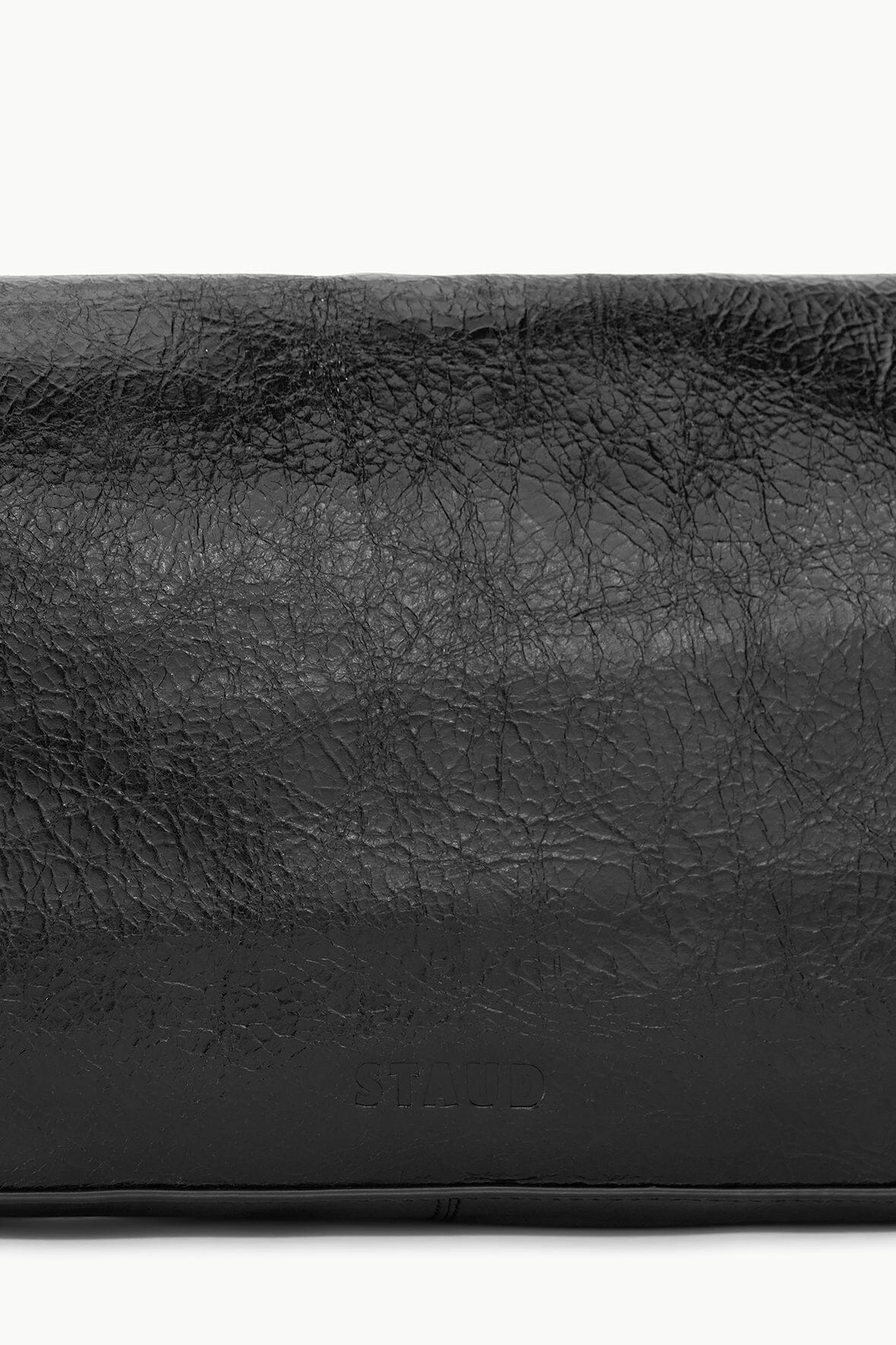 Black leather handbag panel with embossed crackle texture