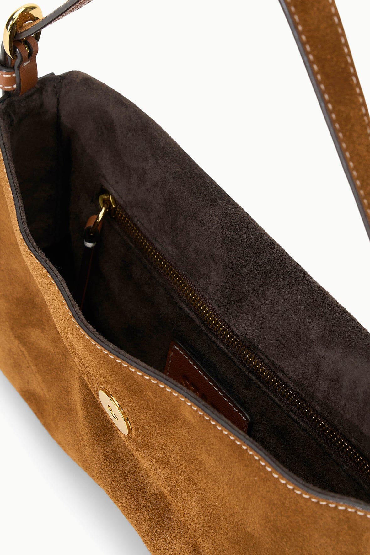 Tan suede Harlow bag interior view with dark lining and zip pocket