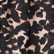 Tortoise-pattern fabric swatch with dark and tan shapes